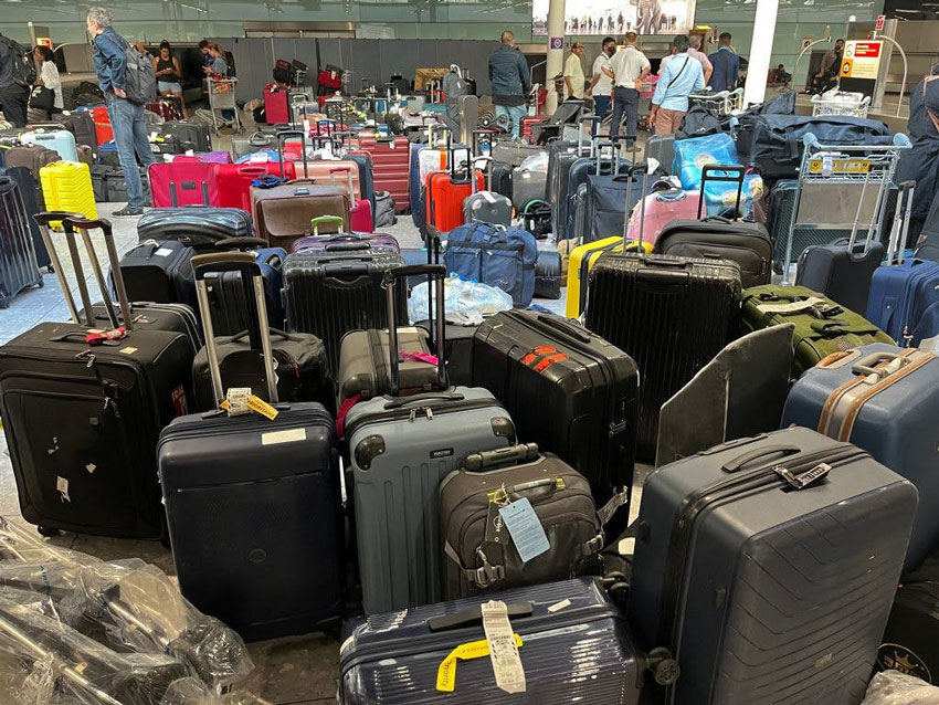 Piles of uncollected luggage in London's Heathrow airport during a system glitch in June © Getty Images