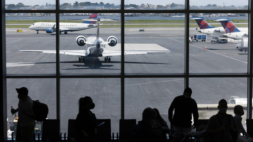 Planes on the tarmac at LaGuardia Airport in New York on August 2, 2021. (Angus Mordant/Bloomberg/Getty Images)