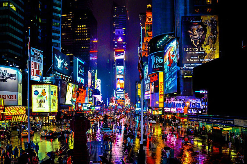 Times Square in New York on a rainy night. © rschalkm/Getty Images/iStockphoto