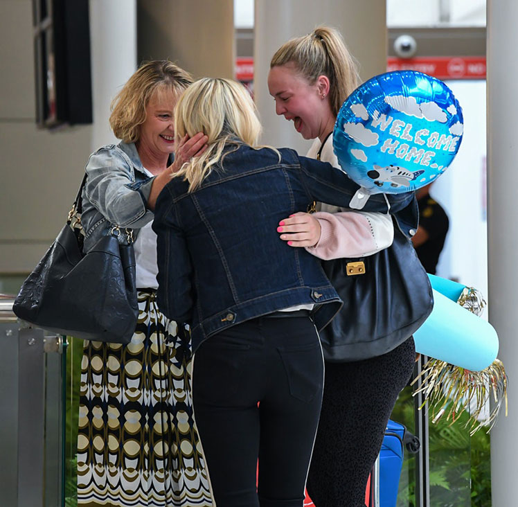 Families hug as they greet each other in the international arrivals area at Sydney's Kingsford Smith Airport after landing on Air New Zealand flight number NZ103 from Auckland ©James D. Morgan/Getty Images