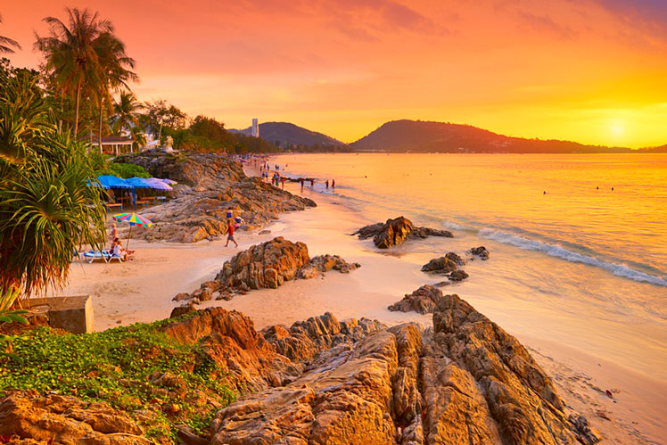 In the high season travelers will flock to hot spots like Phuket © John_Walker / Getty Images