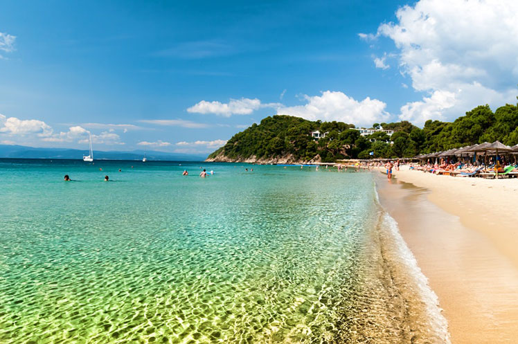 Koukounaries Beach is a popular tourist destination for people visiting the Greek island of Skiathos © David Abrams / Getty Images
