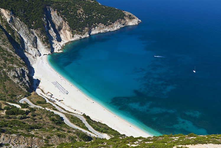 With its striking blue waters, Myrtos Beach is a stunning sight © Panos Karas / Shutterstock