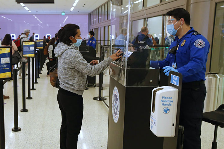 There are acrylic barriers in place at TSA checkpoints © George Frey/Bloomberg via Getty Images