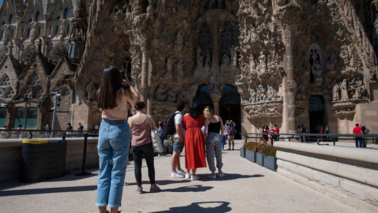 People visit the Sagrada Familia basilica in Barcelona on May 29, 2021. Spain plans to broaden entry to vaccinated travelers in June. Josep Lago/AFP via Getty Images